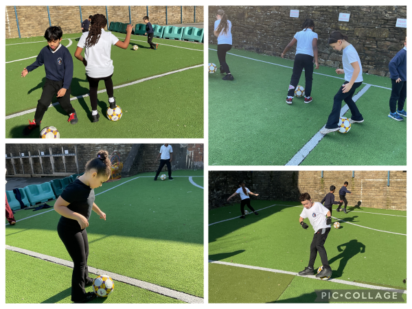 Y4 playing football on the Astro Pitch.